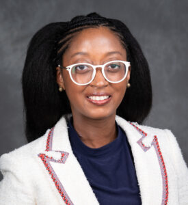 Professional headshot of Dr. Raele Loy