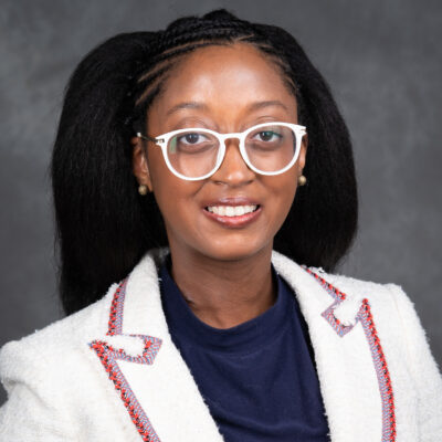 Professional headshot of Dr. Raele Loy